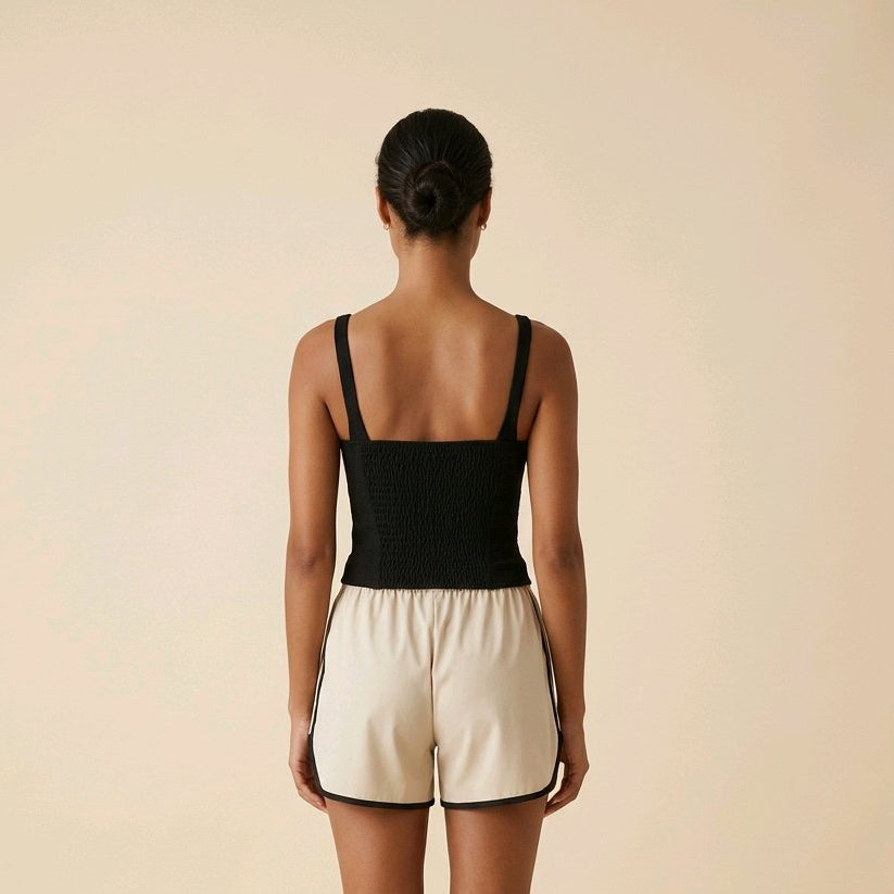 Top corsé negro elegante de algodón con bajo en pico y detalle de encaje Livia de Muzetto 
